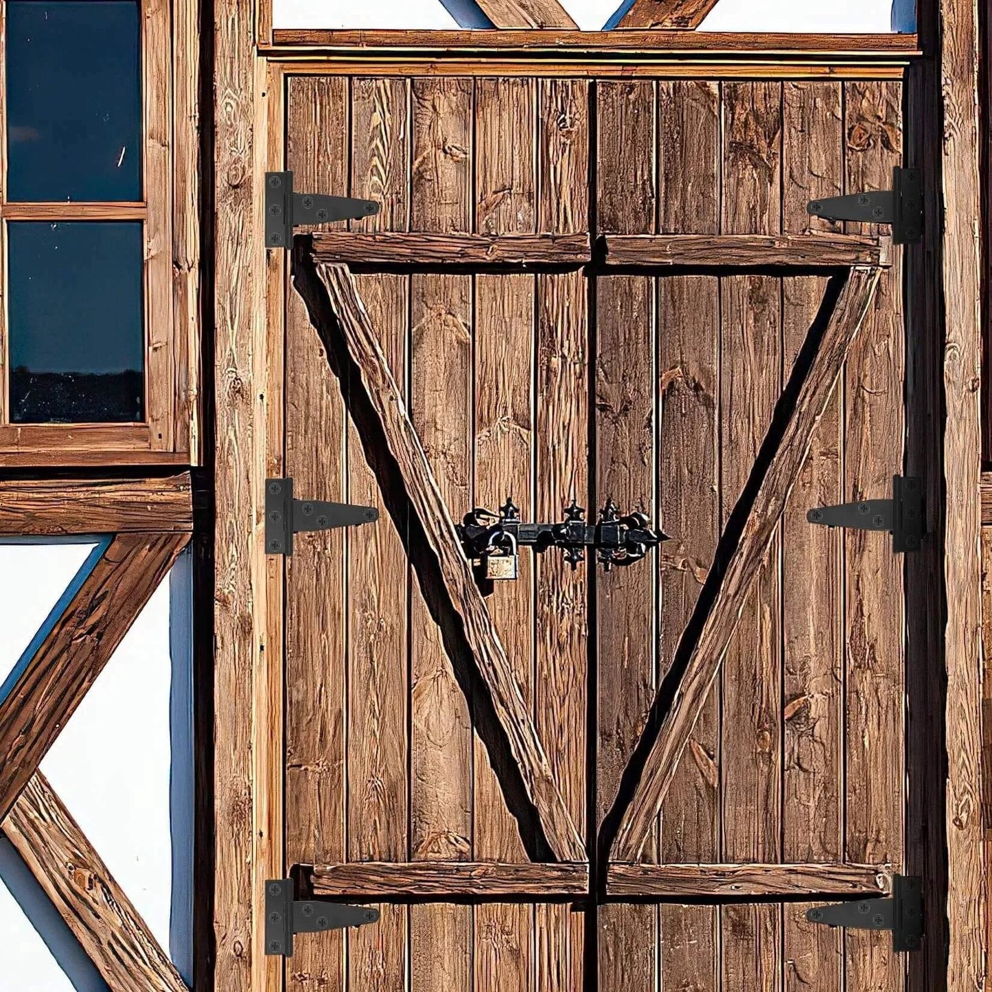 Wooden barn door with heavy duty T strap gate hinges for outdoor doors fences barns and sheds black 12 pack 3 inch durable iron hinges.