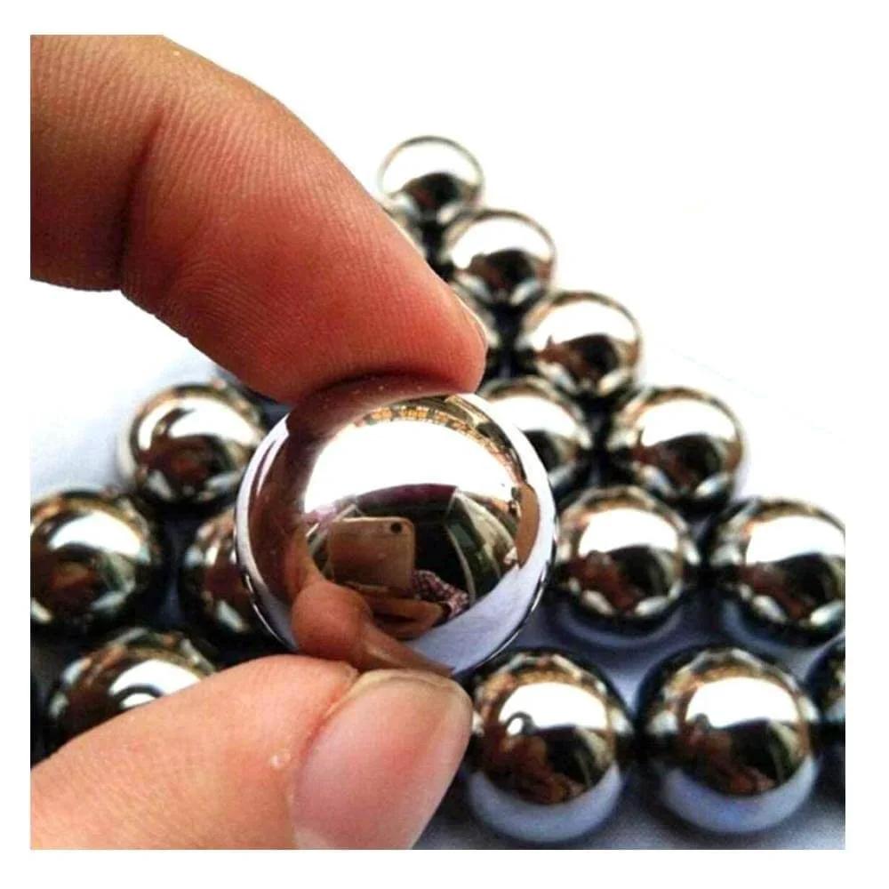 Close-up of 9mm 30 Grain Steel Bearing Balls, Bearing Steel Ball, Solid Ball, Carbon Steel Ball held between fingers.