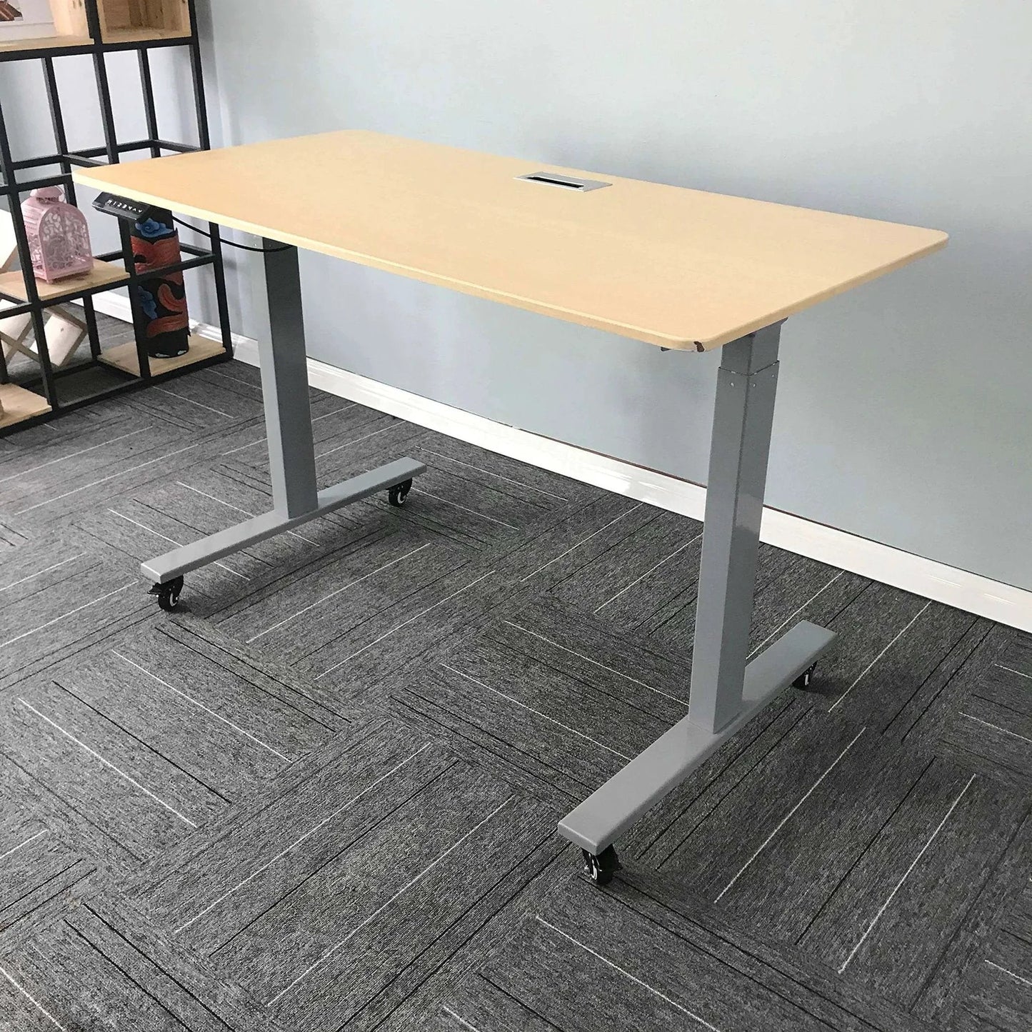 Standing desk with 2 Inch M8 Threaded PU Swivel Casters Set Of 4 With Brakes, installed on gray carpet, showcasing mobility feature.