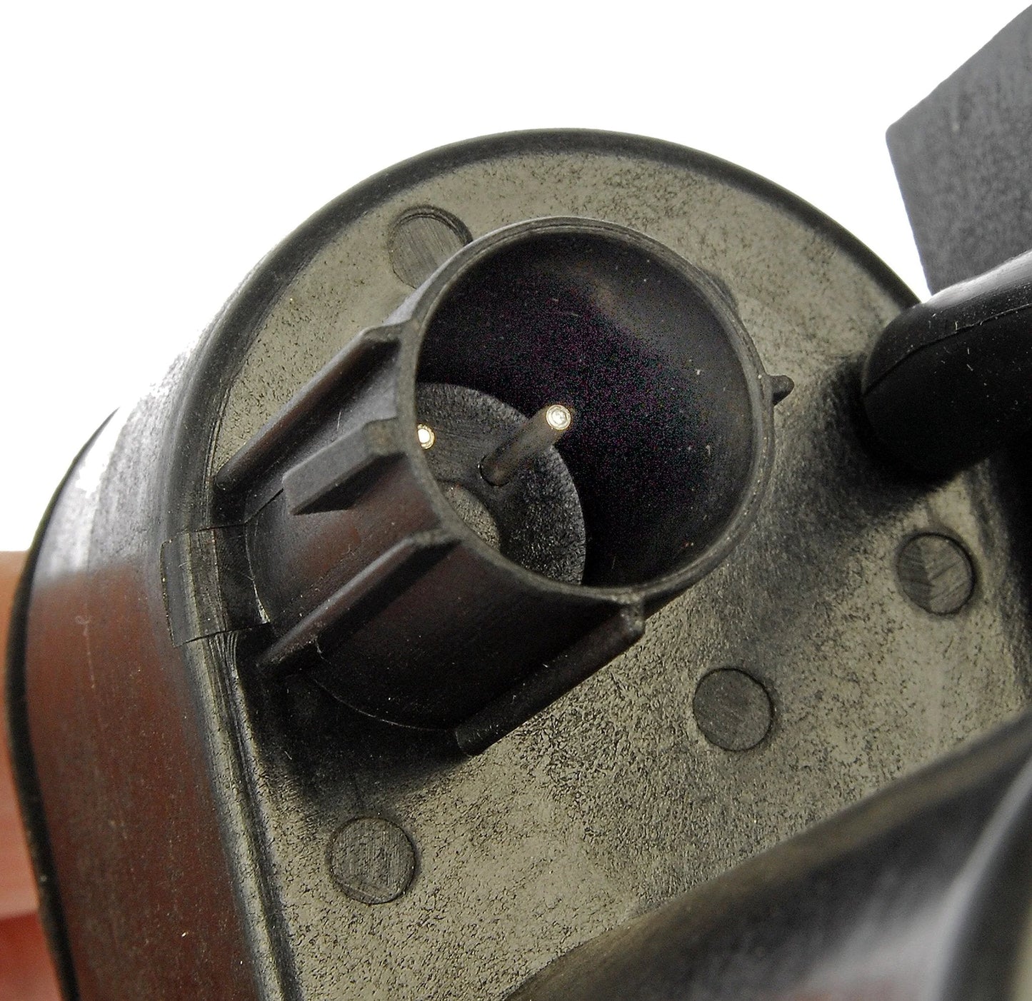 Close-up of a vacuum pump connector for Dodge and Ford vehicles with OE quality, showing plug and durable construction details.