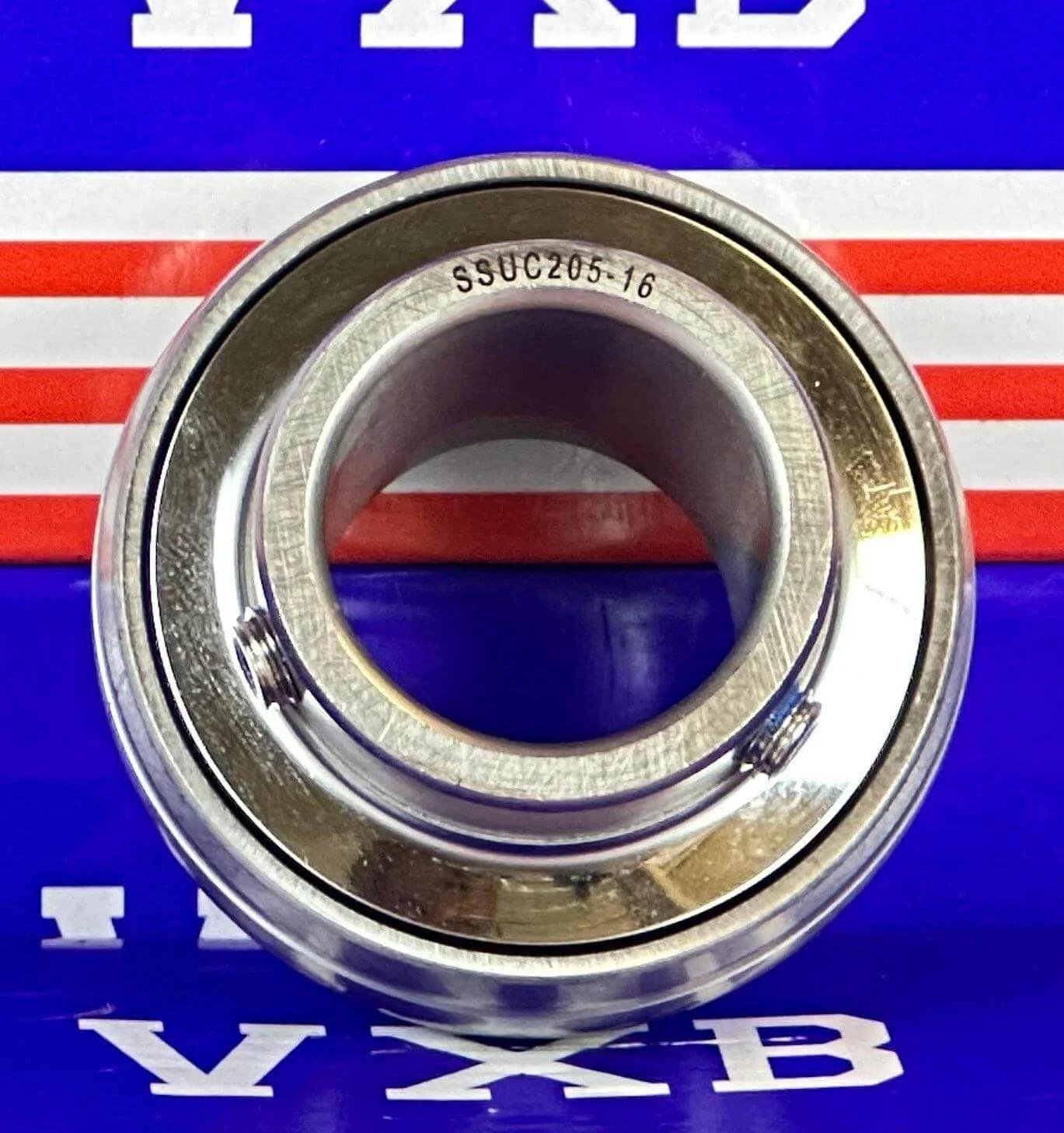 SSUC205-16 Stainless Steel Insert 1" Bore Ball Bearing showcasing its smooth inner surface and durability against corrosion.