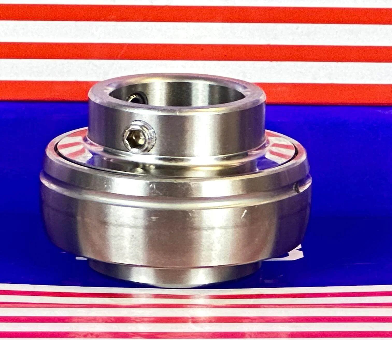 SSUC205-16 Stainless Steel Insert 1" Bore Ball Bearing on a striped background.