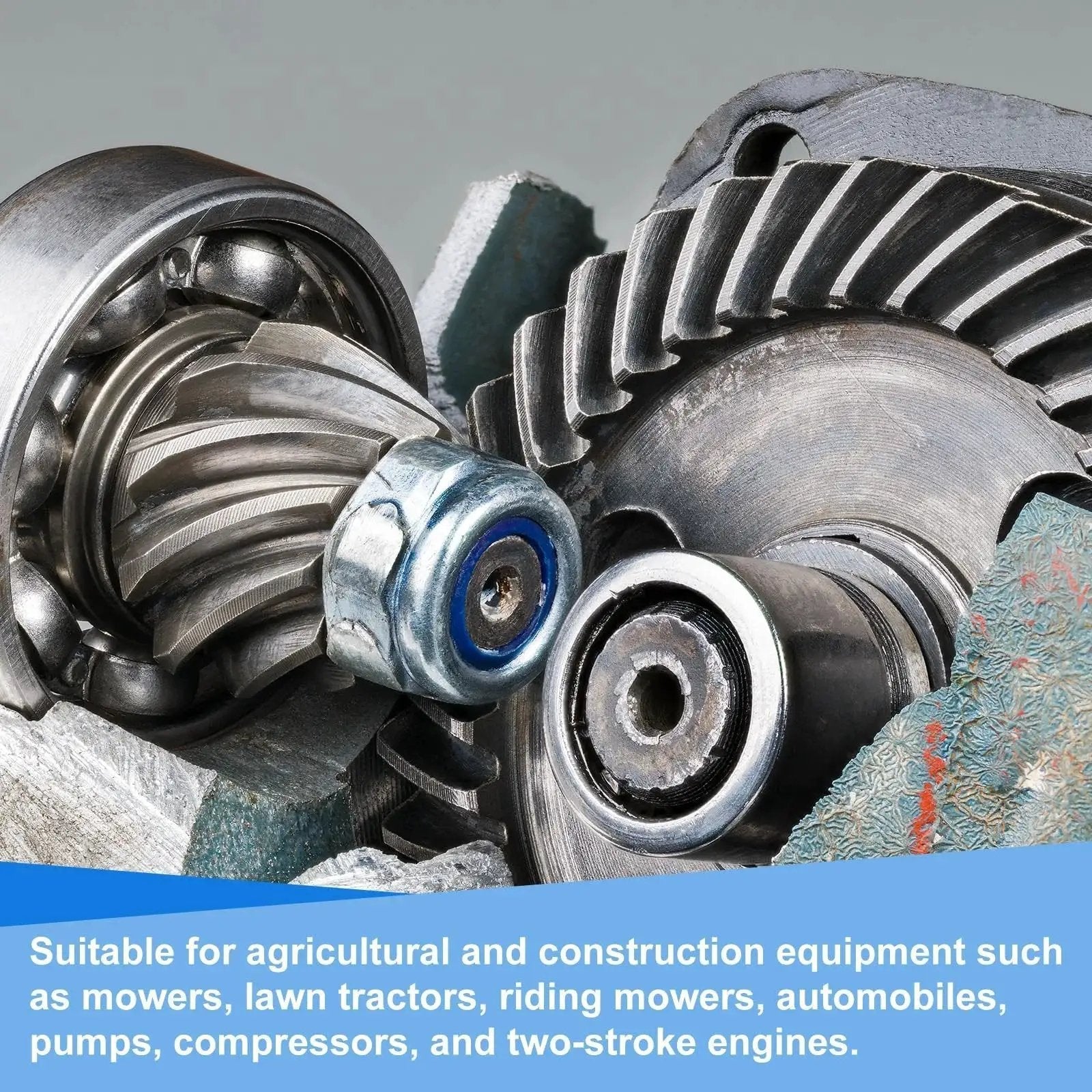 Close-up of metal gears and bearings used in agricultural and construction equipment.