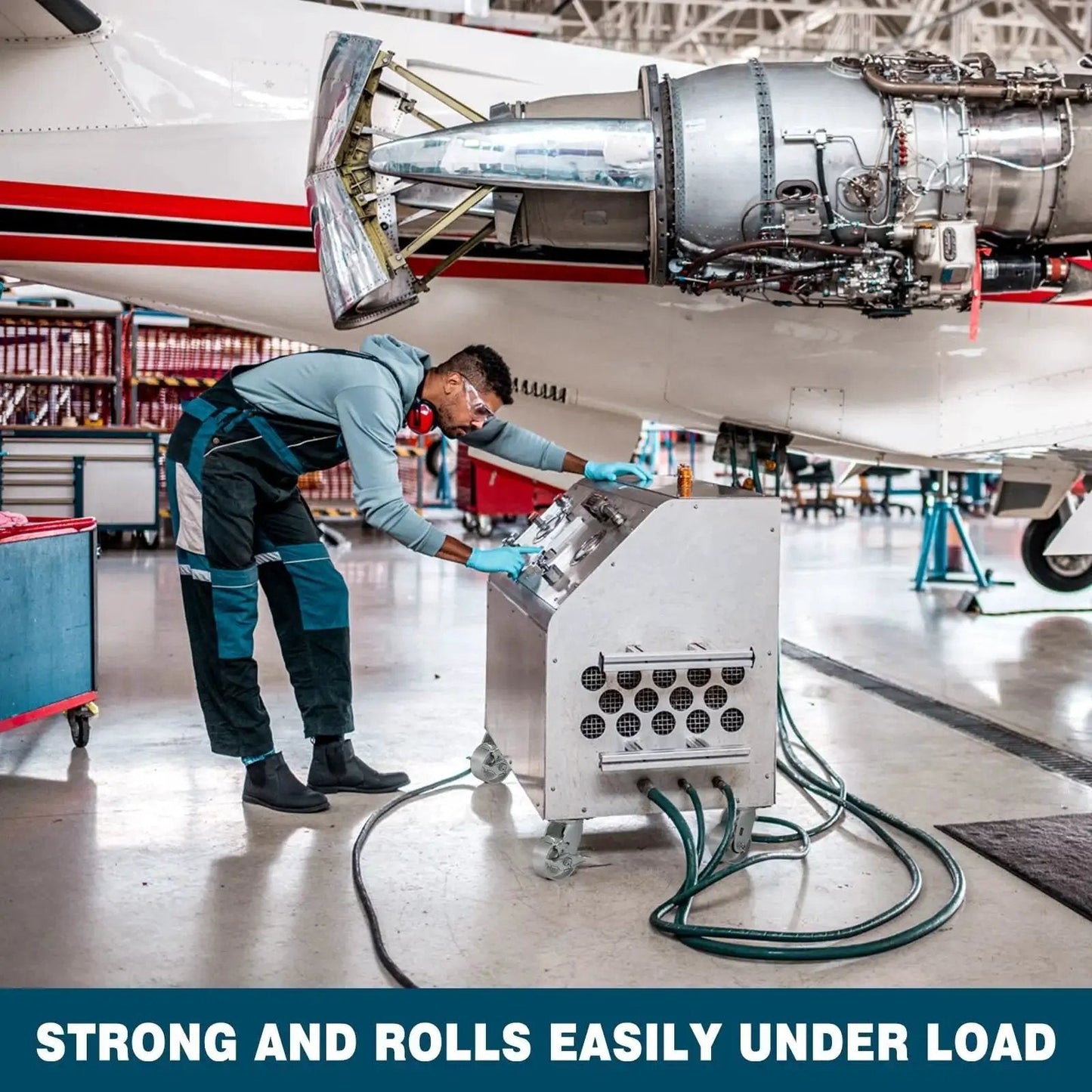 Technician working with equipment featuring Heavy Duty Industrial Casters 6 By 2 Inch Rigid And Brake Wheels on airplane part