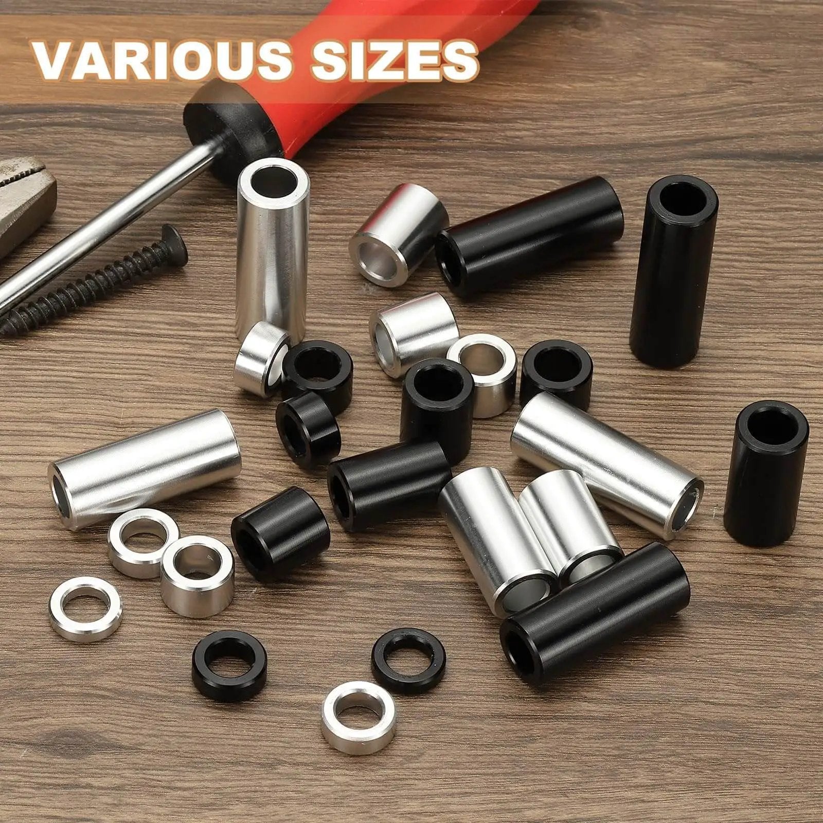 Assorted unthreaded round standoff bushings, featuring Six Piece Aluminum Spacers Set With Quarter Inch Inner Diameter And Half Inch Outer Diameter Three Quarter Inch Length Unthreaded Round Standoff Bushings For Quarter Inch Screws And Bolts Black Patikil, in various sizes, on a wooden surface with a screwdriver.