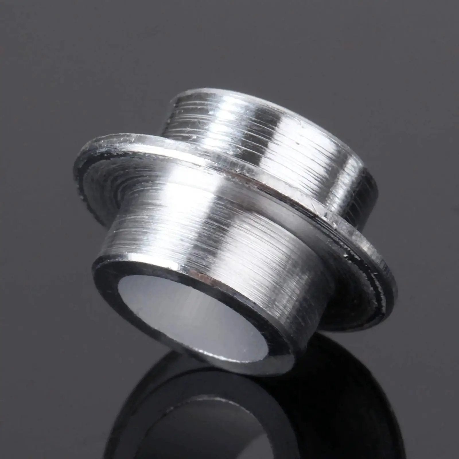Close-up of an aluminum bearing spacer from 8-Pack Inline Skate Bearing Spacers For 8mm Axles Aluminum Wheel Center Spacers.
