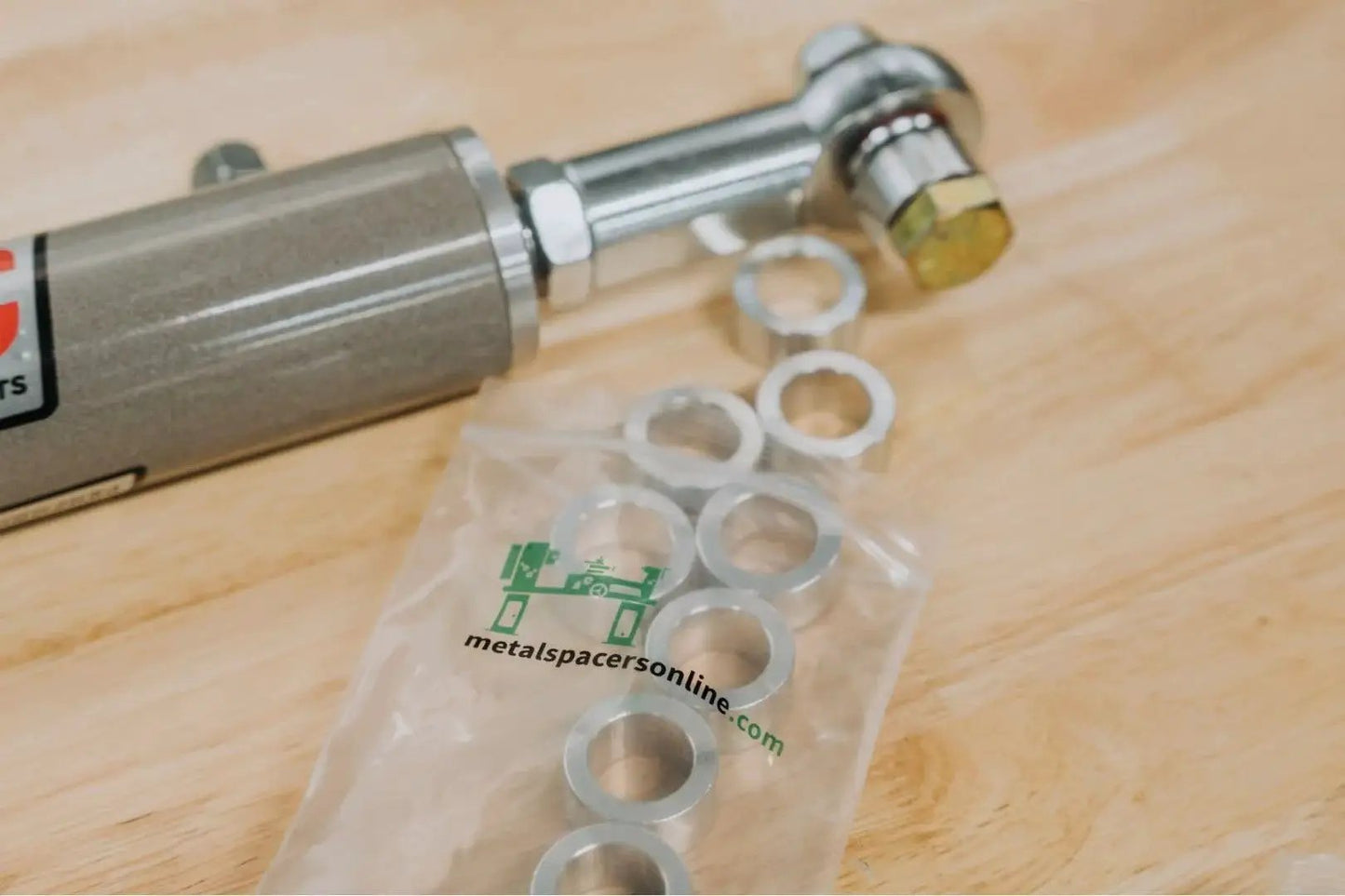 One Half Inch Aluminum Spacer With One Quarter Inch Inner Diameter Unthreaded Round Standoff Bushing In Plain Finish Heavy Duty Build Fits One Quarter Inch Bolts Or M6 Choose Length One And A Half Inches Pack Of Ten on table
