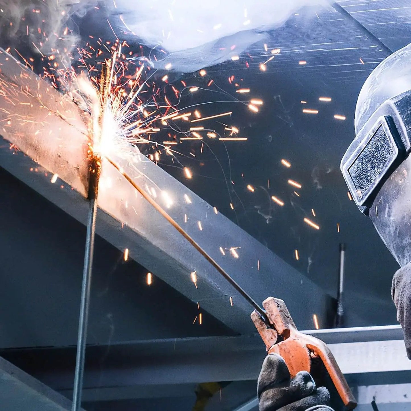 Close-up of welder using E4043 Aluminum Welding Rods 1 lb 1/8 in by 14 in AWS A5.3 Class E4043 for precise aluminum alloy repair.