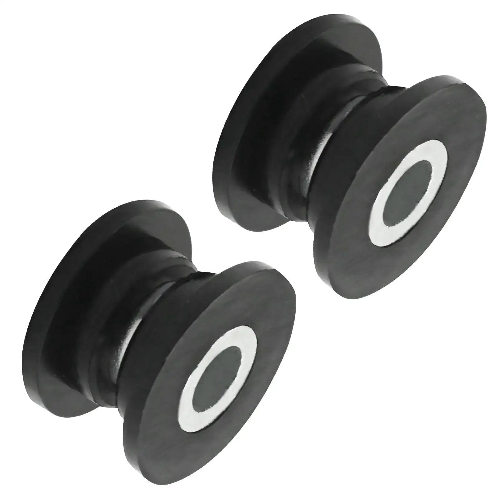 Close-up of two bushings from the Eight Piece Absorber Shock Bushing And Bearing Sleeve Kit For Arctic Cat ATVs Including Models 250 300 400