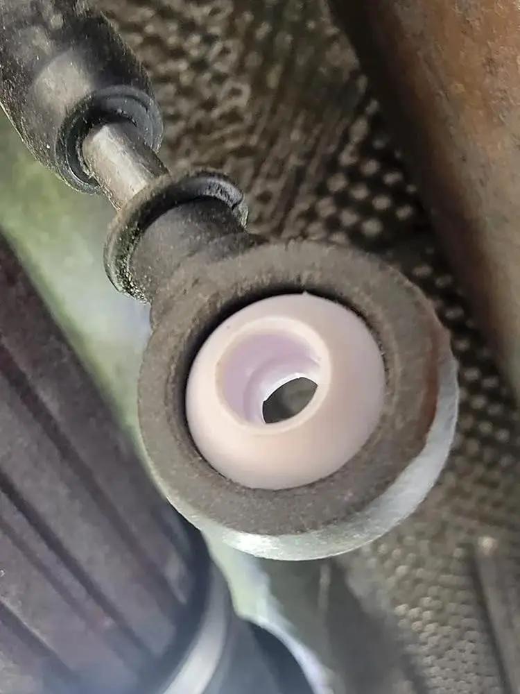 Installed view of Automatic Transmission Shift Cable Bushing Repair Kit for loose shifting fix in vehicle's gear selector linkage.