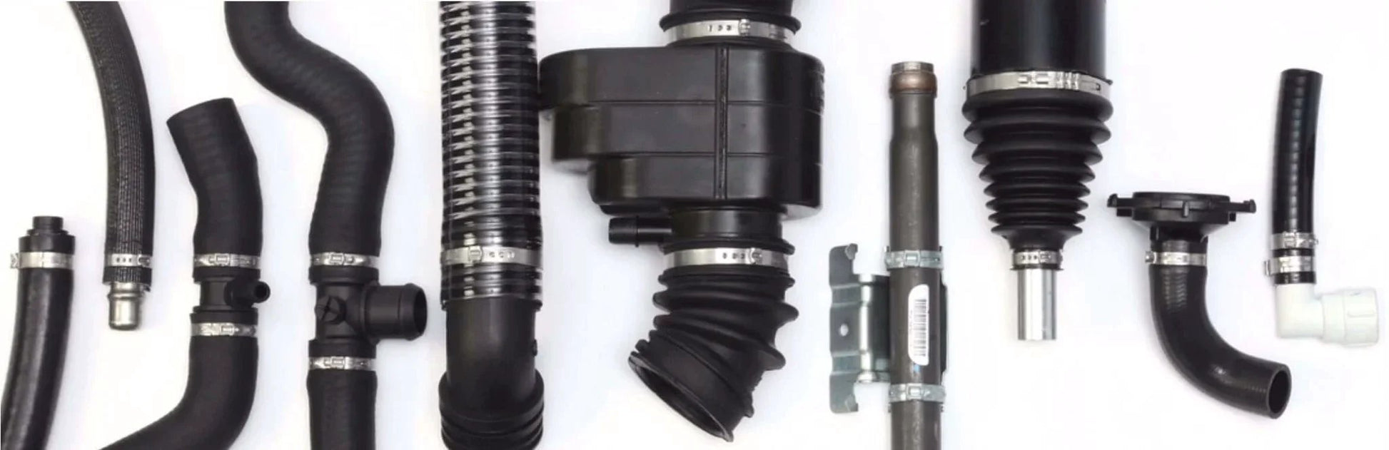 Various automotive pipes and components with clamps for assembly