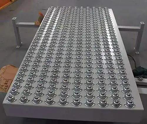Sixteen Piece Five Eighth Inch Ball Transfer Bearings Set Flange Mounted Carbon Steel Heavy Duty 360 Degree Rotation Units on table
