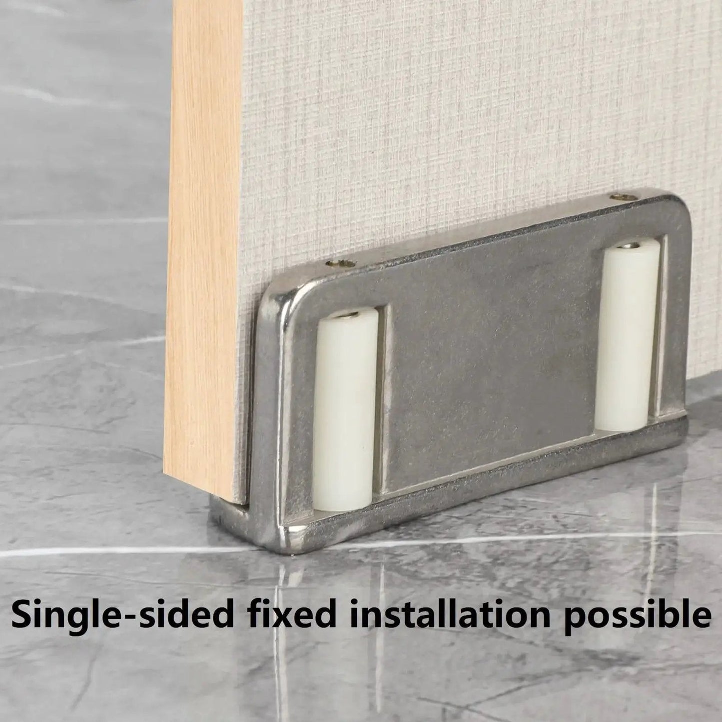 Four Barn Door Floor Guide Bearings With Adjustable Bottom Rollers In Durable Steel Frame, installed on door.