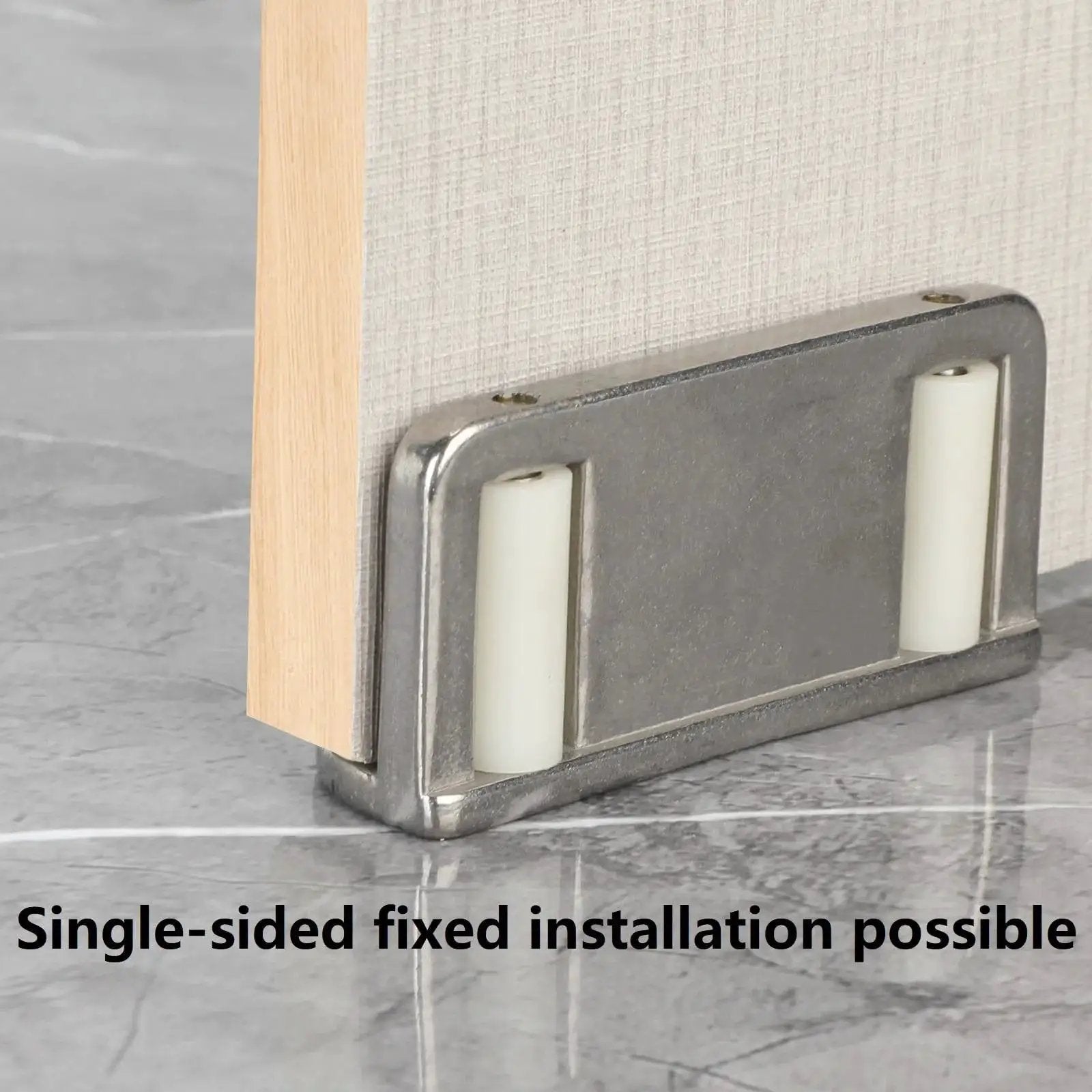 Four Barn Door Floor Guide Bearings With Adjustable Bottom Rollers In Durable Steel Frame, installed on door.