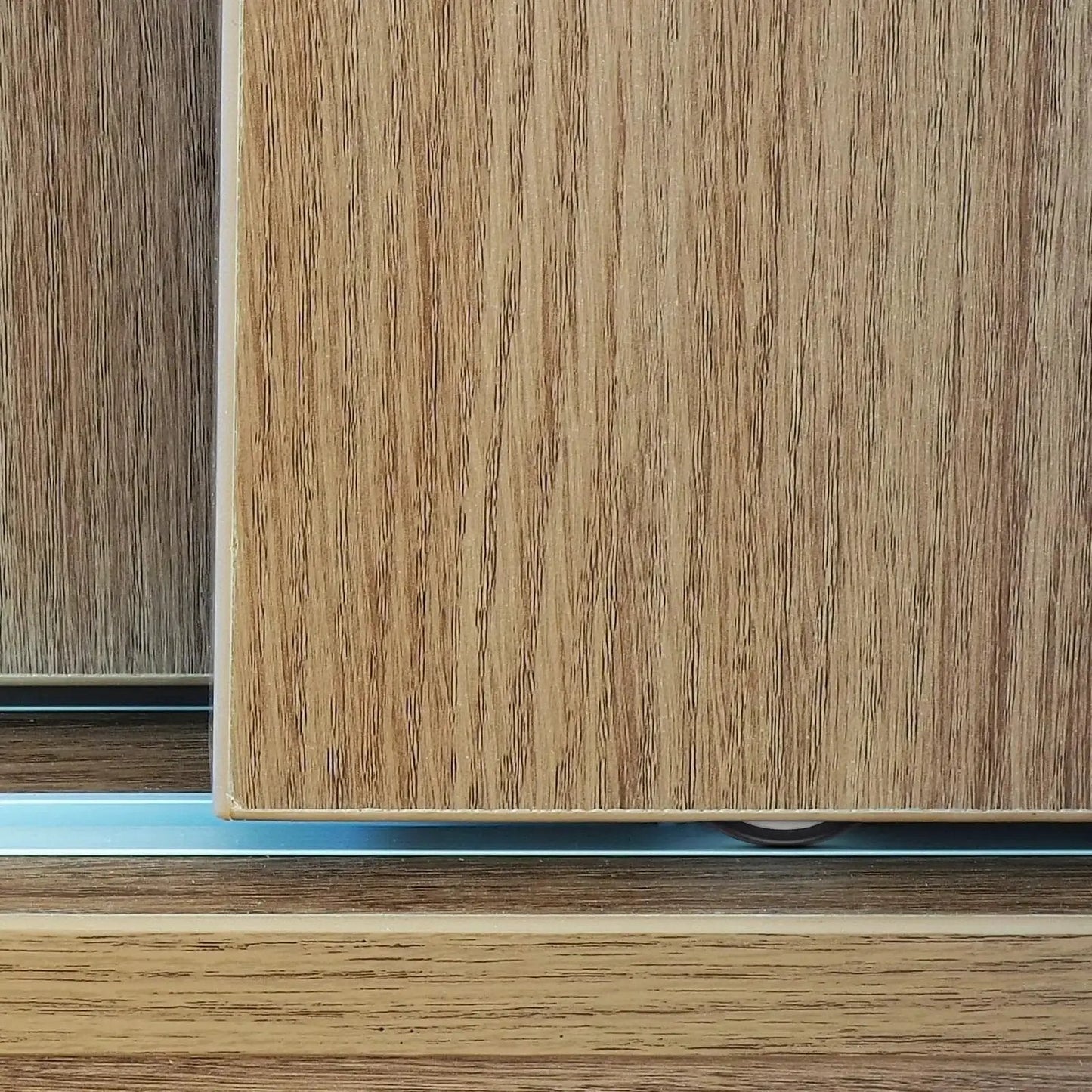 Close-up view of 4 Pieces Barn Door Kit With Sliding Door Rollers And Track Wheels For Wardrobe Cupboard Cabinets including bottom pulley