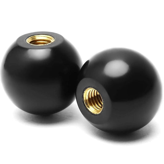 Close-up of black Bakelite knobs with 3/8-16 threads, part of Five Pack 3/8-16 Threaded Ball Knobs For Lawn Mowers 1-3/8 Inch Diameter Bakelite Thermoset Handle Black