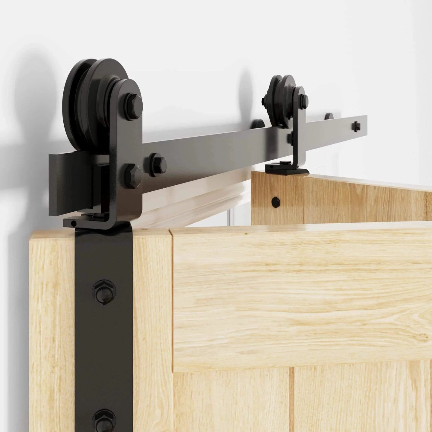 Close-up of heavy duty bifold barn door hardware kit, 54" track folding system mounted on wooden door, black carbon steel