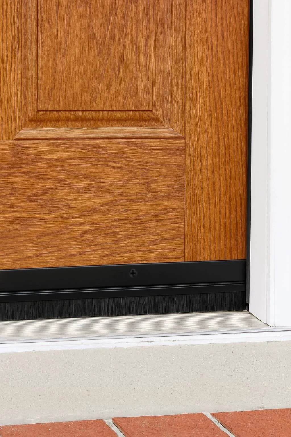 Door Sweeps - Aluminum & Brush - Brush Sweeps for Gaps Up to 1” - Black Trim with Black Brush installed on wood door