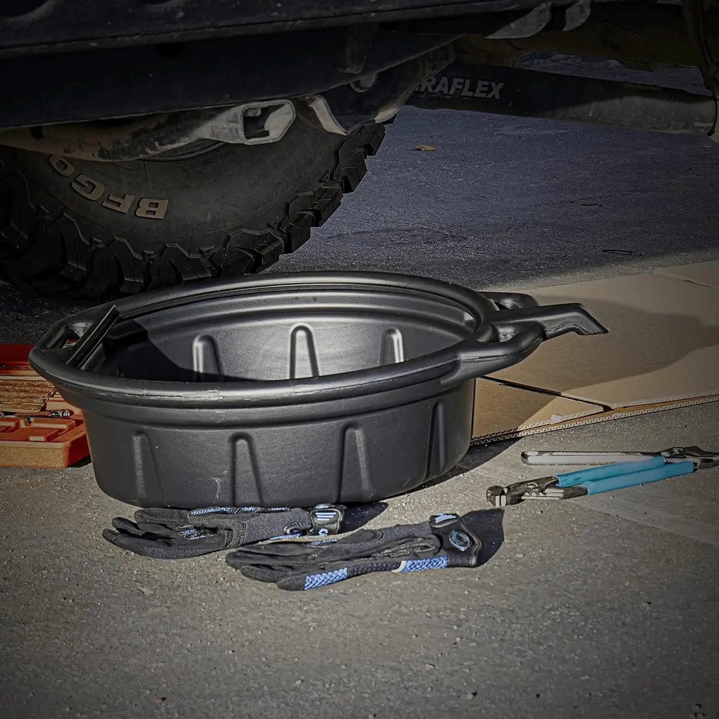 Oil Drain Pan 2 Gallon Capacity Black Plastic Anti Splash Lip Drip Catcher For Motor Oil Gasoline And Antifreeze shown under vehicle