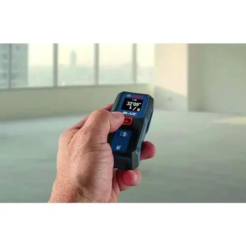Effortlessly capture precise room dimensions and layout distances with a compact Blaze laser distance meter in use.