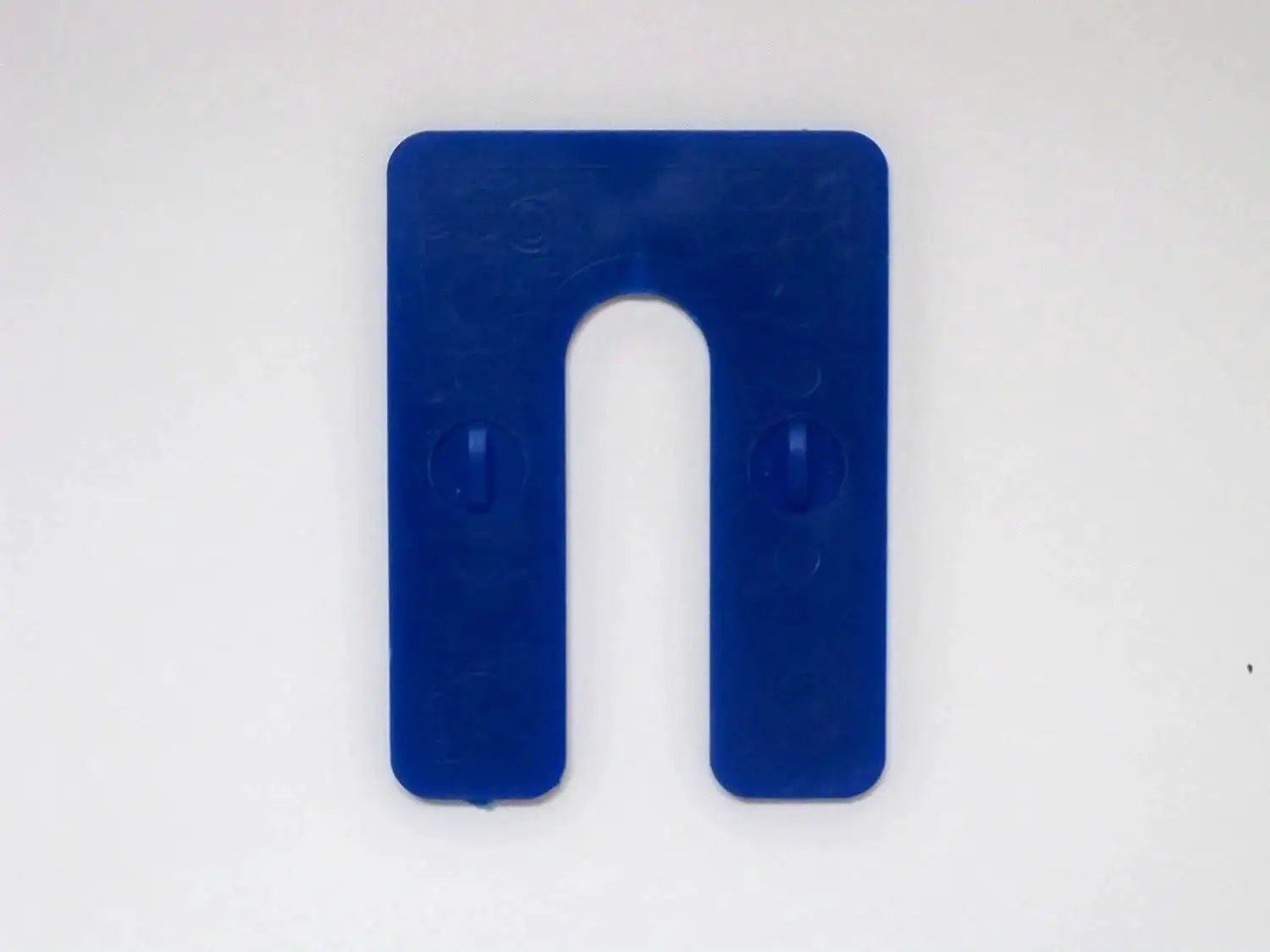 Blue plastic U shim from the Plastic U Shims Variety Pack Blue One Sixteenth Inch Red One Eighth Inch Black One Quarter Inch Shims In Three By Four Inch Size Ten Pieces Each For A Total Of Thirty Color Coded Alignment Spacers For DIY Furniture Appliances And Automotive