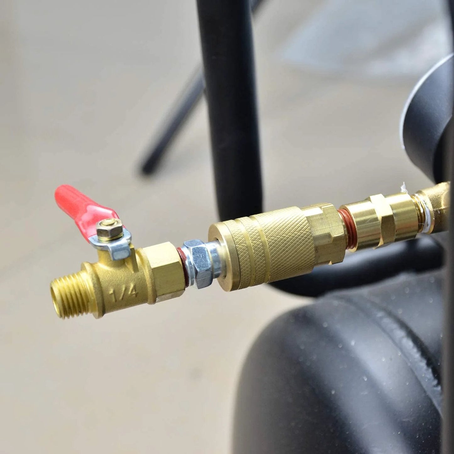 Durable Brass 1/4 Inch Quick Connect Air Coupler Set, Two Pieces With 1/4 Inch NPT Male Threads, Industrial Grade, Corrosion Resistant, Long Lasting, Interchangeable With Most Brands, Yellow Finish by GASHER connected to air hose with valve.