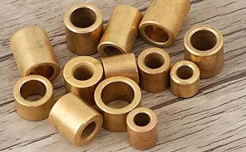 10 Pcs Sleeve Bearing Set With 10 Mm Bore 16 Mm Outer Diameter And 20 Mm Length Self Lubricating Bushings bronze on wood surface