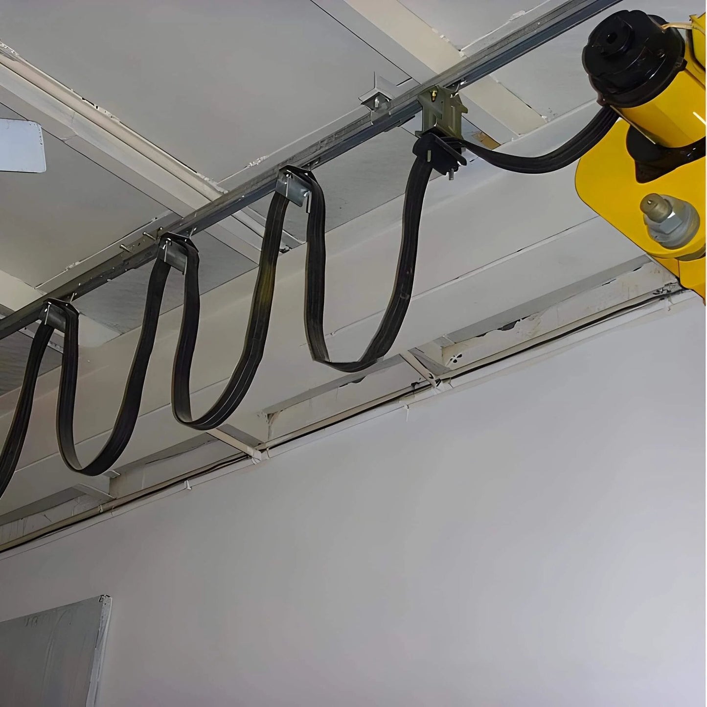 2 Wheel Cable Trolley Assembly Rollers with Dual Bearings for 1-5/8 Inch & Taller Strut Channel in a ceiling setup