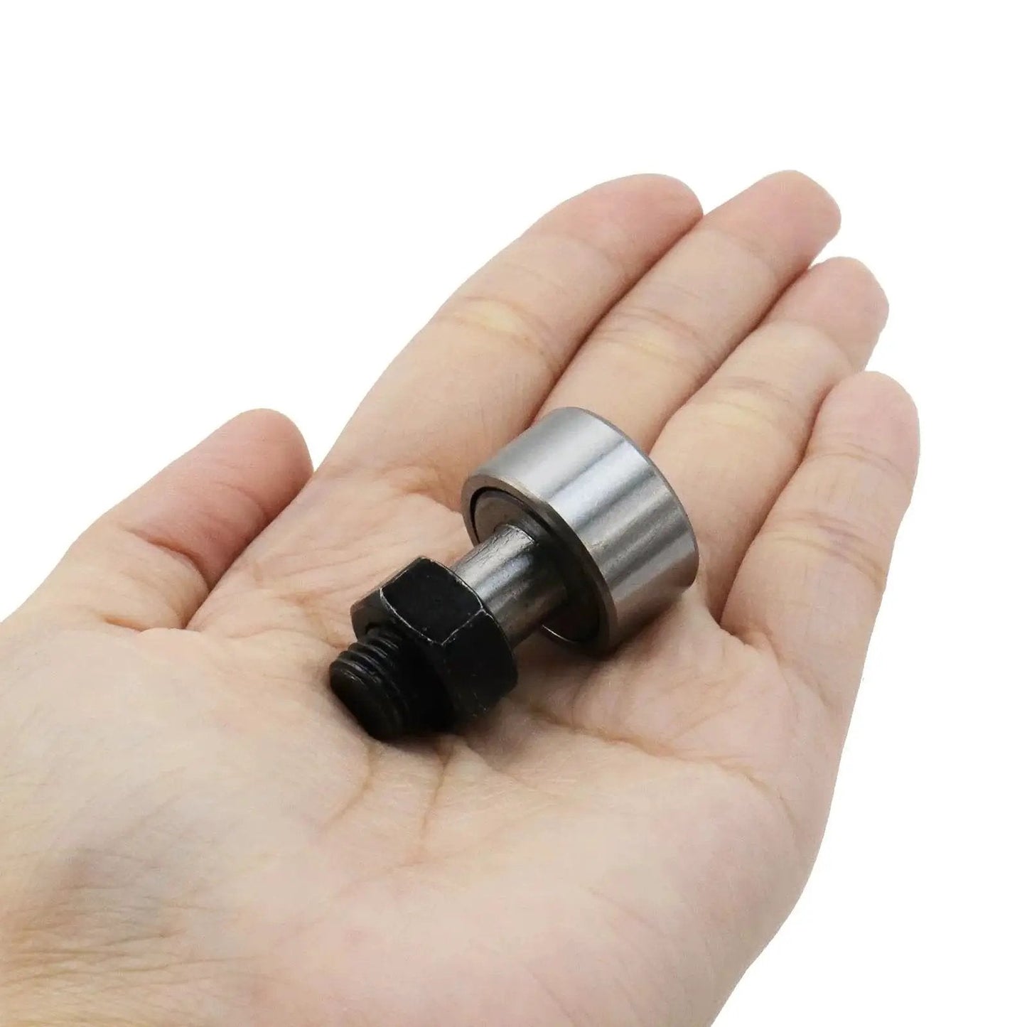 Person holding a 4 Pack Cam Follower Bearings Set For Track Runner KR22 Type Needle Roller, M10 x 1.25mm Thread, 22mm Roller Diameter.