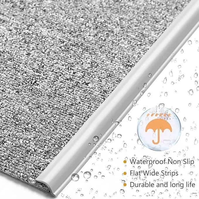 Close-up of waterproof Carpet to Tile Transition Strip, Self Adhesive Cuttable Carpet Edge Trim Strip with water droplets and features.