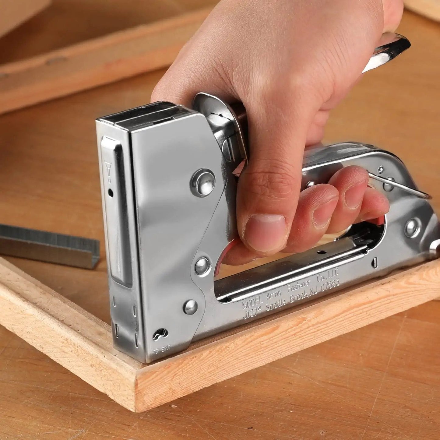 Using Light Duty Staple Gun Kit With 2000 Three Eighths Inch JT21 Staples Rubber Grip And Chrome Steel Housing on wood frame