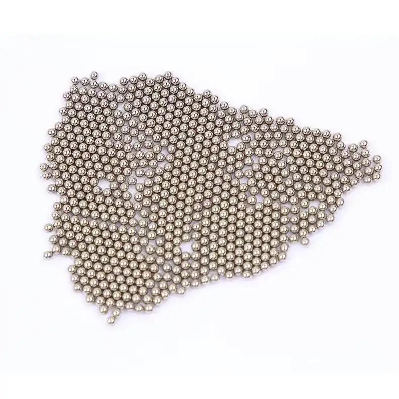 One Eighth Inch Chrome Steel Bearing Balls Set Of 100 shown in a scattered pile, highlighting their spherical shape and metallic finish.