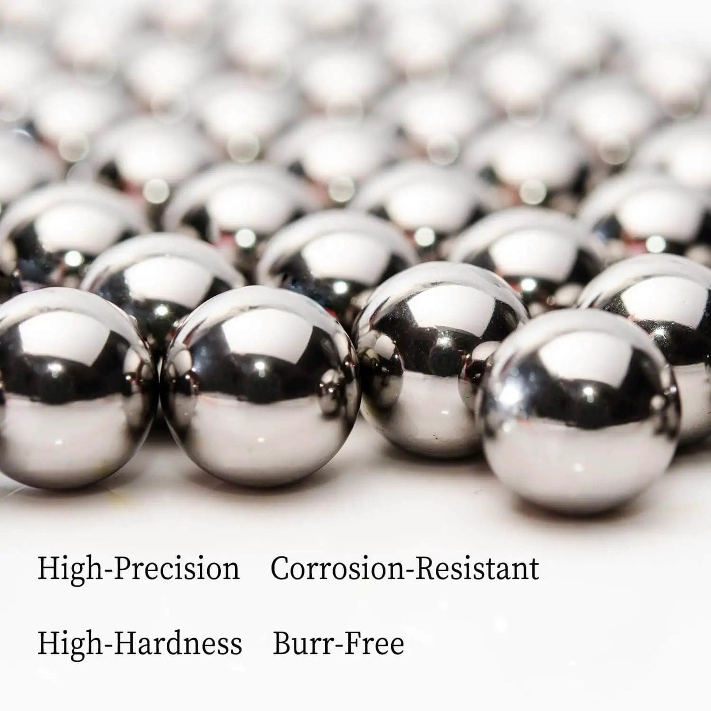 Close-up of Two 2 Inch Diameter Hardened Chrome Steel Bearing Balls Two Piece Set for Precision Machines, mirror-polished finish