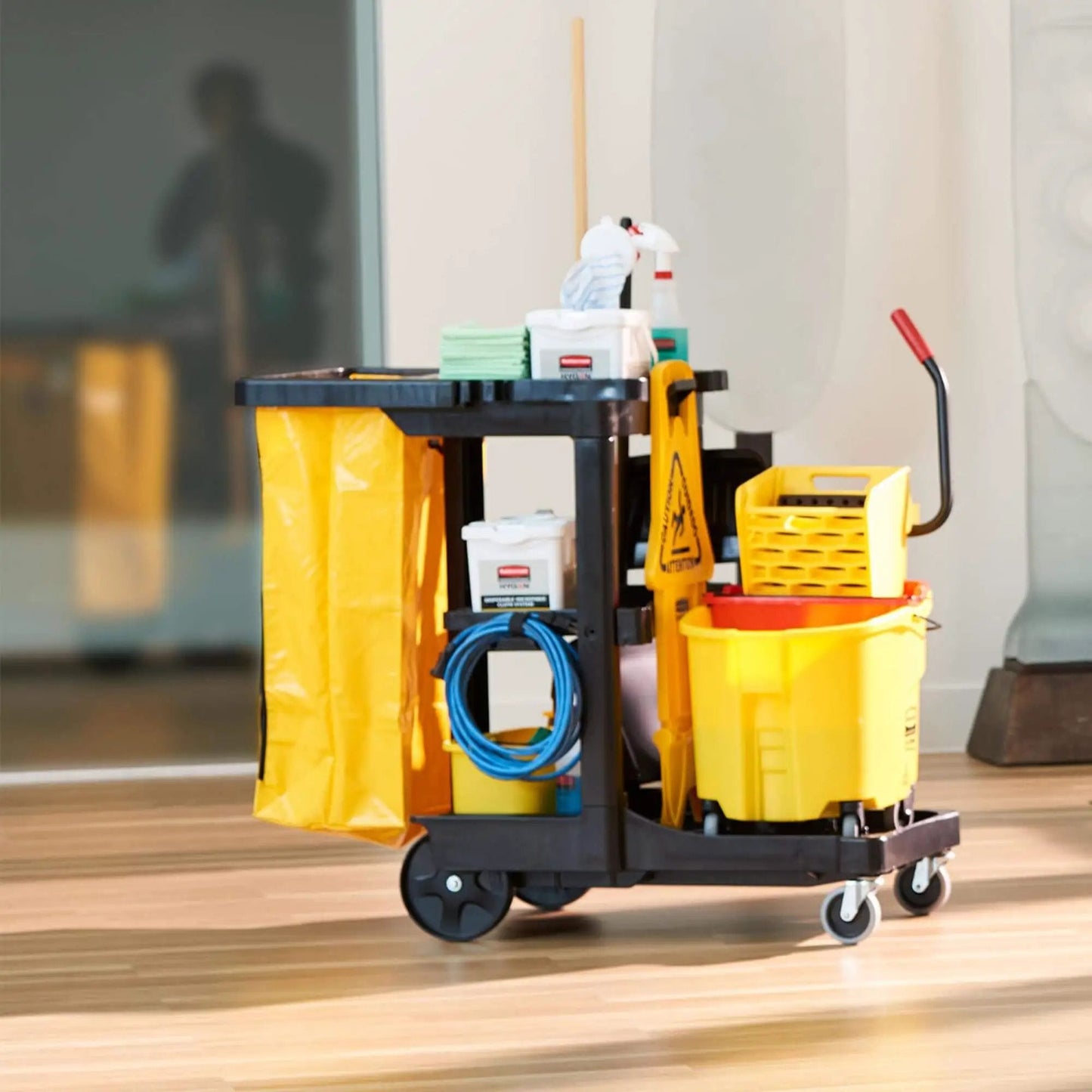 Workhorse Commercial Cleaning Cart with 3 shelves, yellow vinyl bag, mop bucket, tools for janitorial use in offices and schools