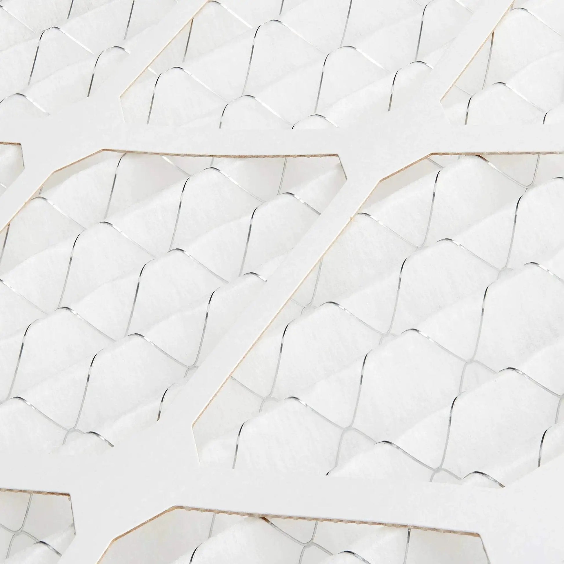Close-up view of MERV 8 furnace air filter material with electrostatic design, trapping dust, pollen, and lint for allergy relief.