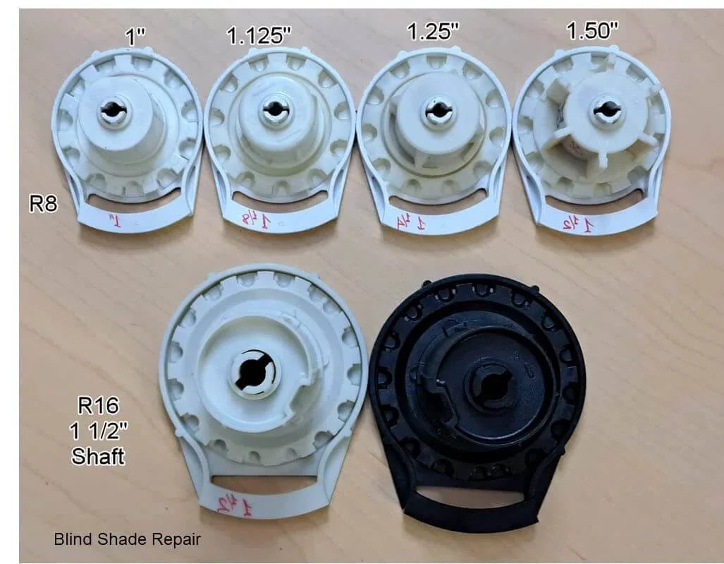 Six clutch units with bead stoppers including Clutch R Series with Bead Stopper (White, R16-1 1/2" Tube) on wooden surface.