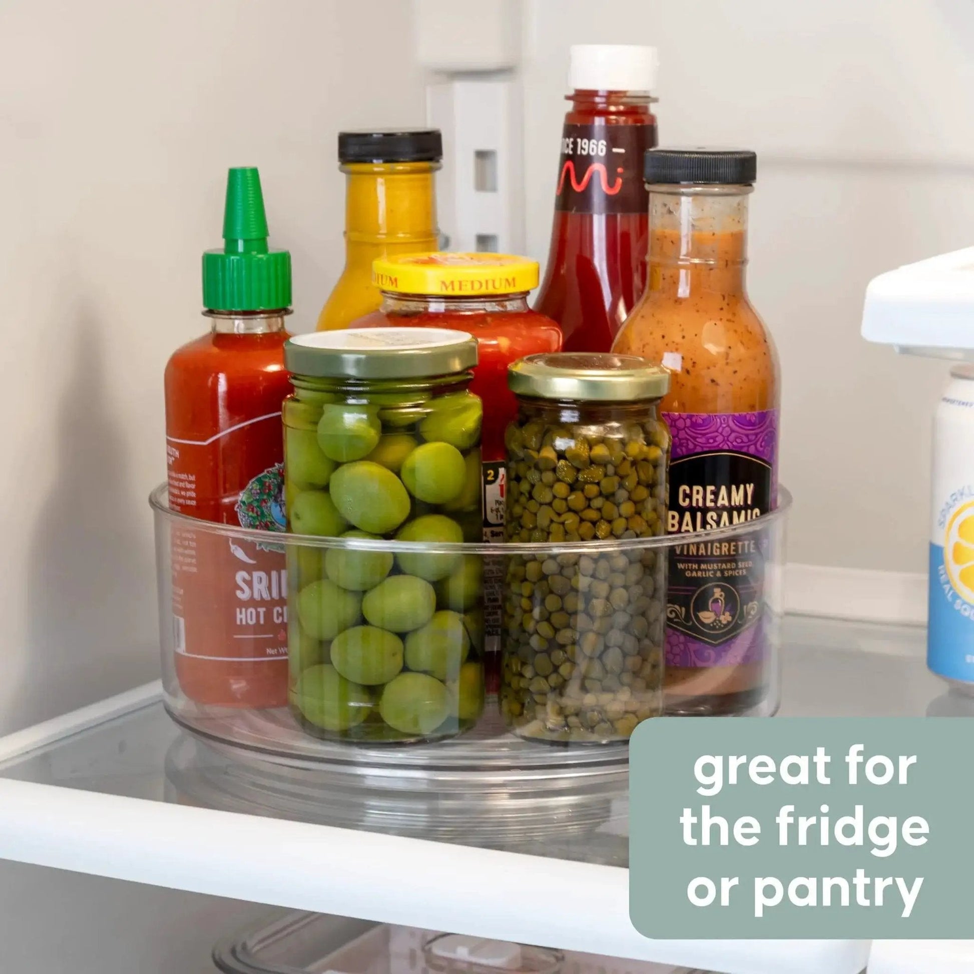 Compact Lazy Susan Organizer for Fridge and Cabinet holding condiments and spices, showcasing smooth 360 degree turntable storage.
