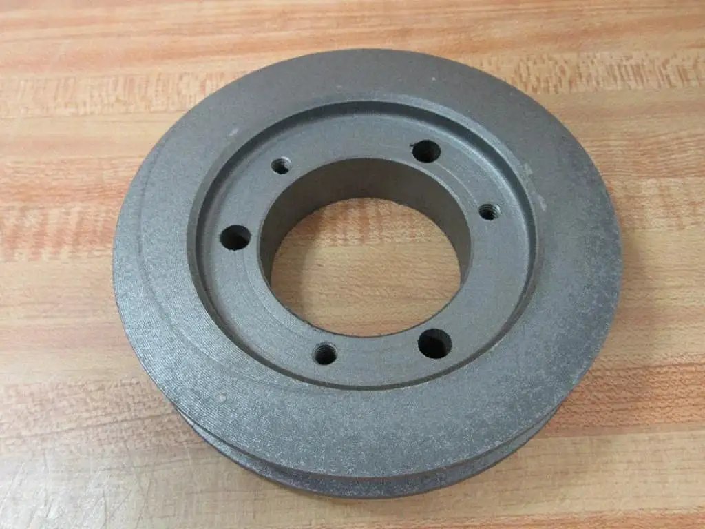 Compact SDS pulley with 5 inch outer diameter and 2-1/8 inch bore laid on wooden surface for power transmission in CNC setups
