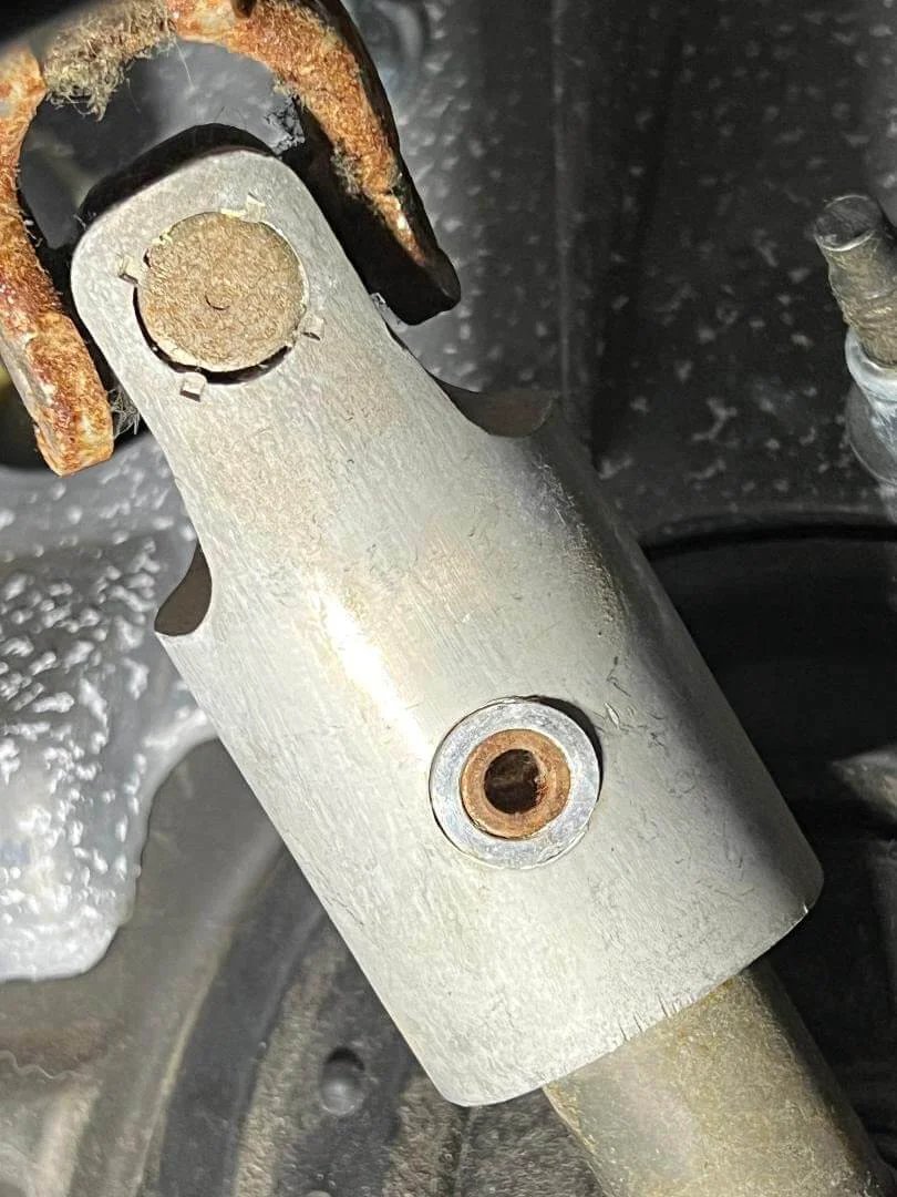 Close-up of Hardened 6061-Billet Intermediate Shaft Bushing Steering Column Sleeve in aluminum, installed in Dodge Ram.