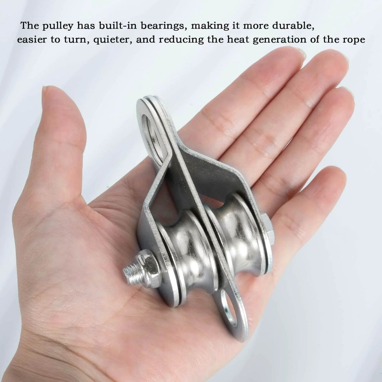 Hand holding Double Pulley Block Small Snatch Cable for 0.23Inch/6mm Wire Rope, showing bearings and metal finish