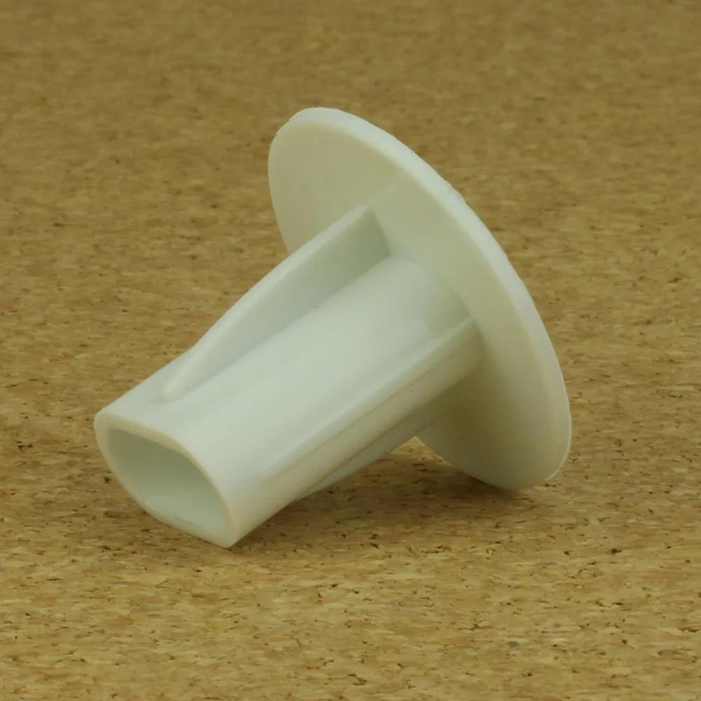 Close-up of Dual Feed Through Cable Bushings White 100 Pack For Low Voltage Wall Openings, featuring durable silicone seal.