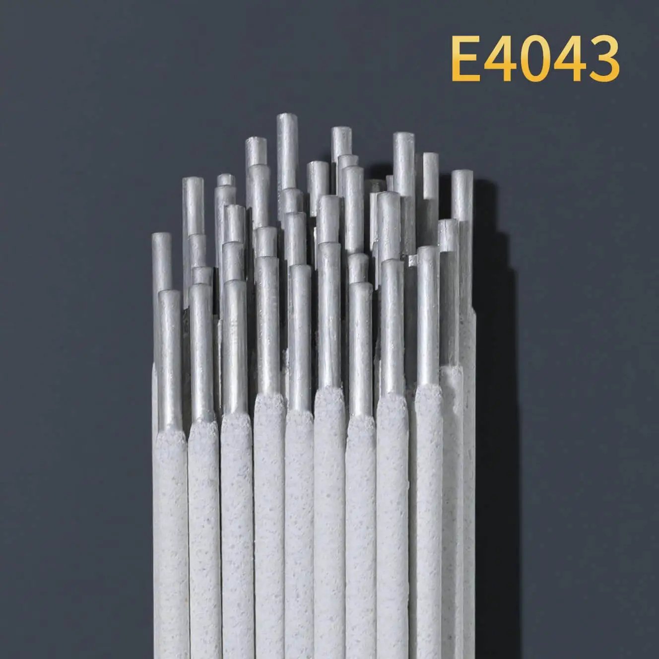 Close-up of E4043 Aluminum Welding Rods 1 lb 1/8 in by 14 in AWS A5.3 Class E4043 for Aluminum Alloy Repair against dark background.