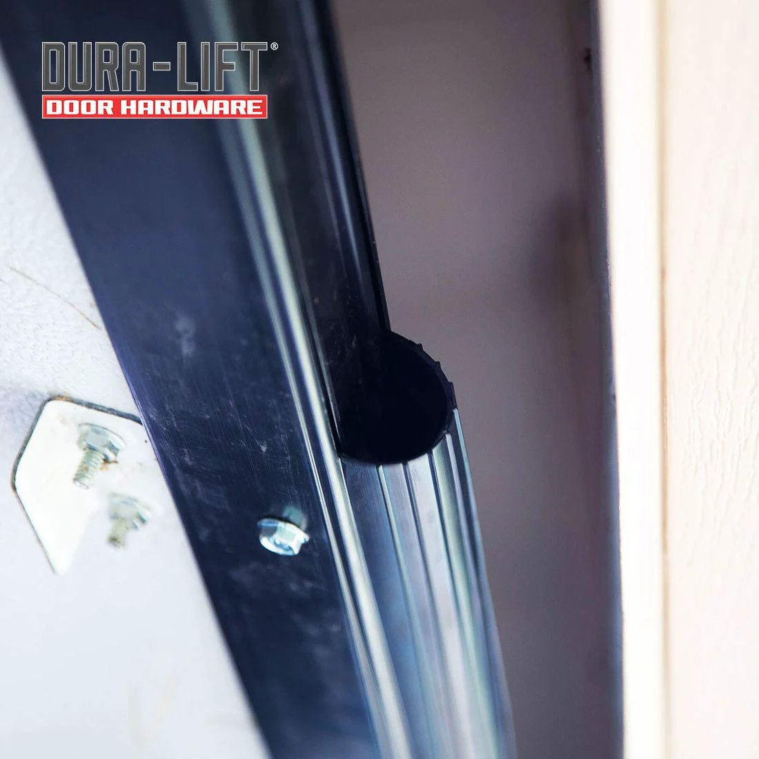 Close-up view of Premium EPDM Rubber Weather Seal For 8 Foot Wide Garage Doors Double Black installed in garage door frame.