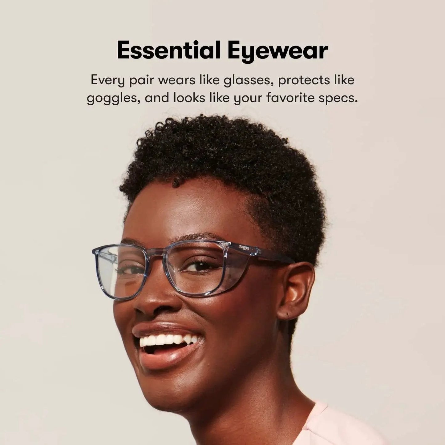 Person wearing Z87.1 Certified Safety Glasses With Blue Light Blocking And Anti Fog Coating, smiling in a casual setting.