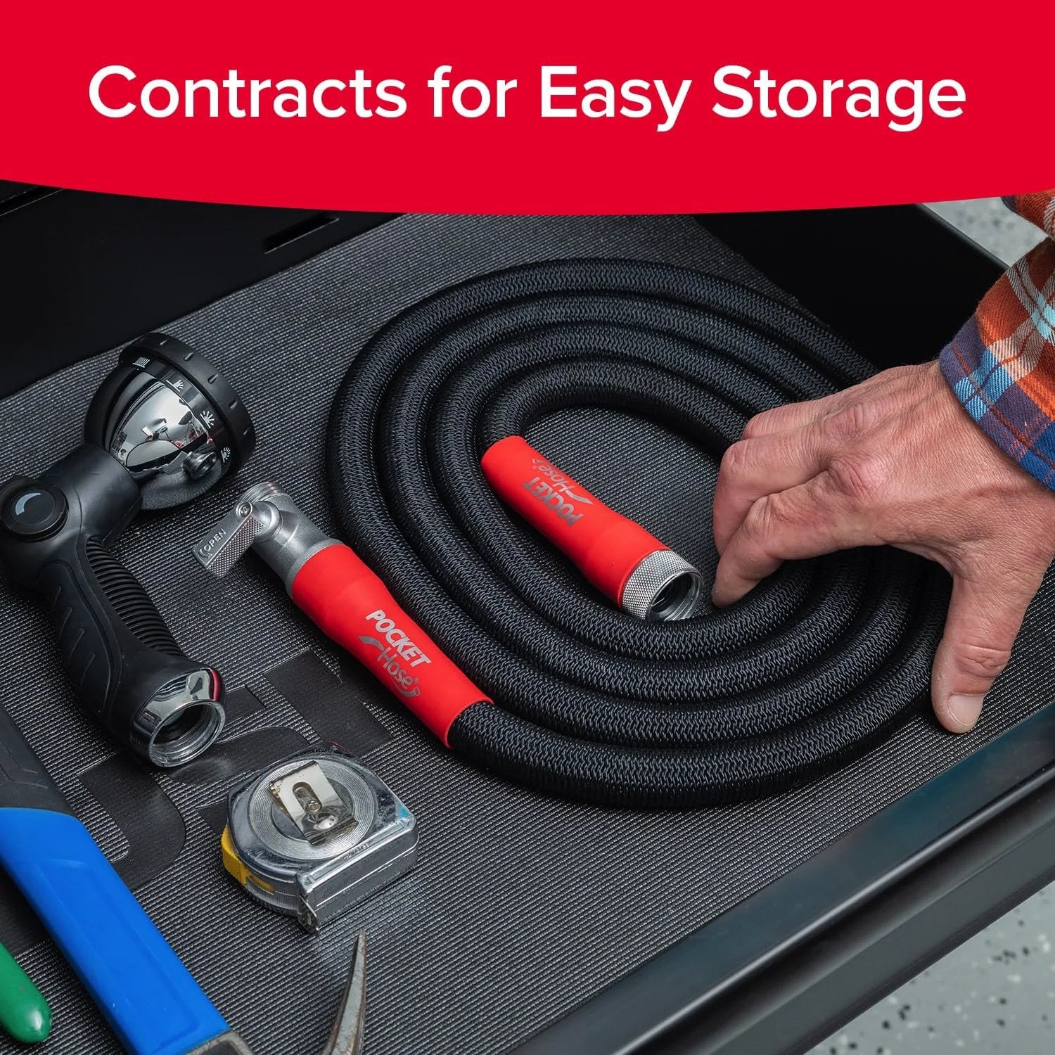 Expandable Garden Hose That Grows From 50 Feet To Full Size With Turbo Shot Nozzle Lead Free Solid Aluminum Connectors Easy On Off Valve Kink Free And Leak Proof As Seen On TV Pocket Hose Silver Bullet 2.0 coiled in a storage drawer with a spray nozzle.