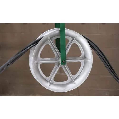 Feeding Sheave for 3-1/2-Inch Conduit with metal wheel guiding cables, mounted on a welded steel frame, shown in side view.