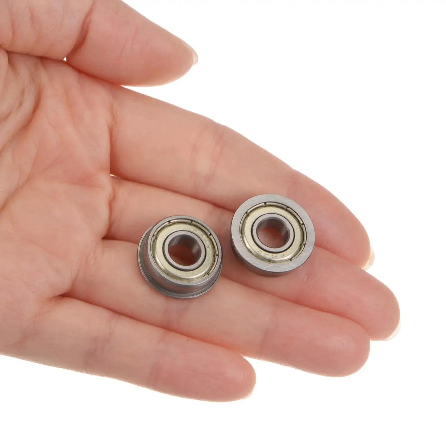 Hand holding Flanged Ball Bearing 1 Quarter By 5 Eighth By 0.196 Inch Double Shielded Chrome Steel FR4ZZ 4 Pack