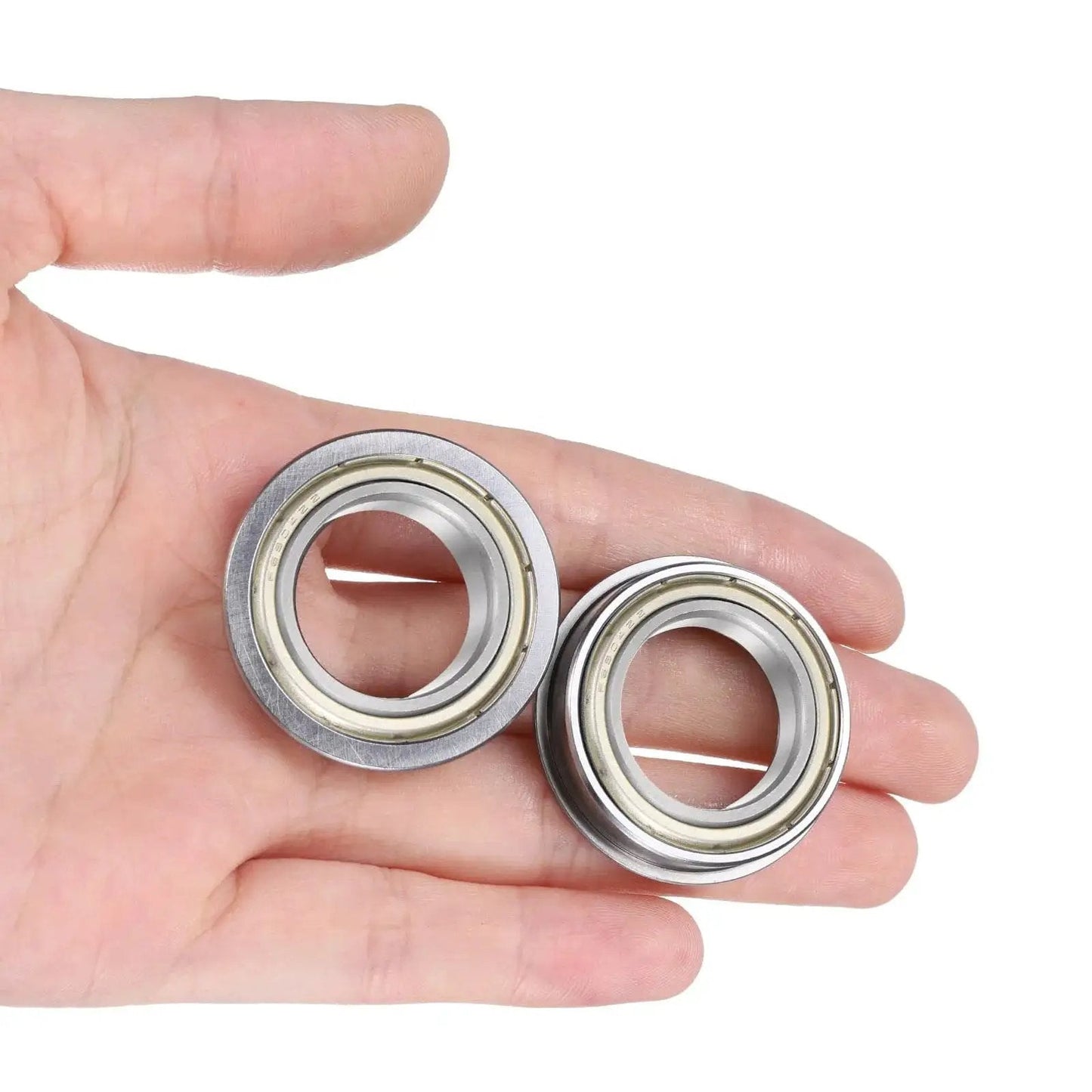 F6804ZZ Flanged Ball Bearing With Double Shielding 20x32x7mm Chrome Steel held in a hand showing size and design