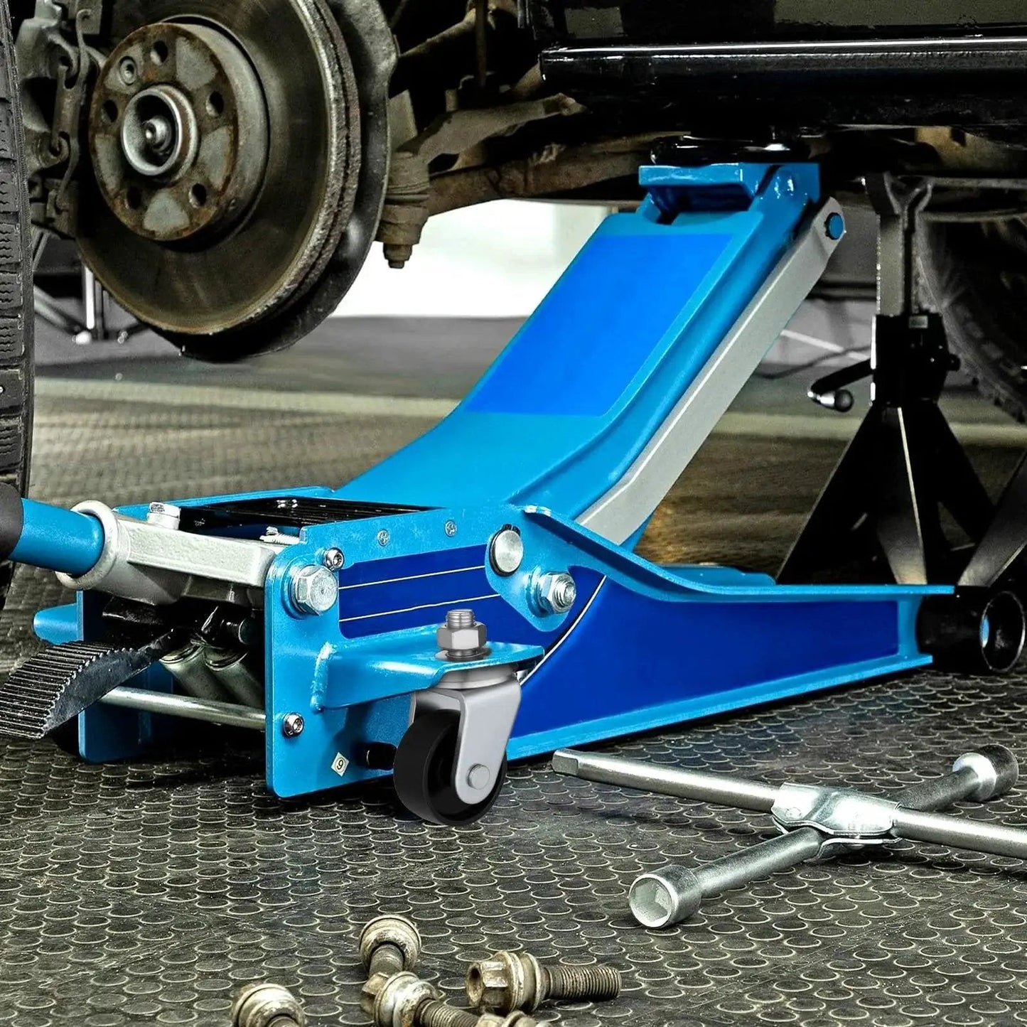 2 Pcs Floor Jack Casters For 4 Ton Floor Jack With Cast Iron Construction And 16mm Stem installed on a blue floor jack in a garage.