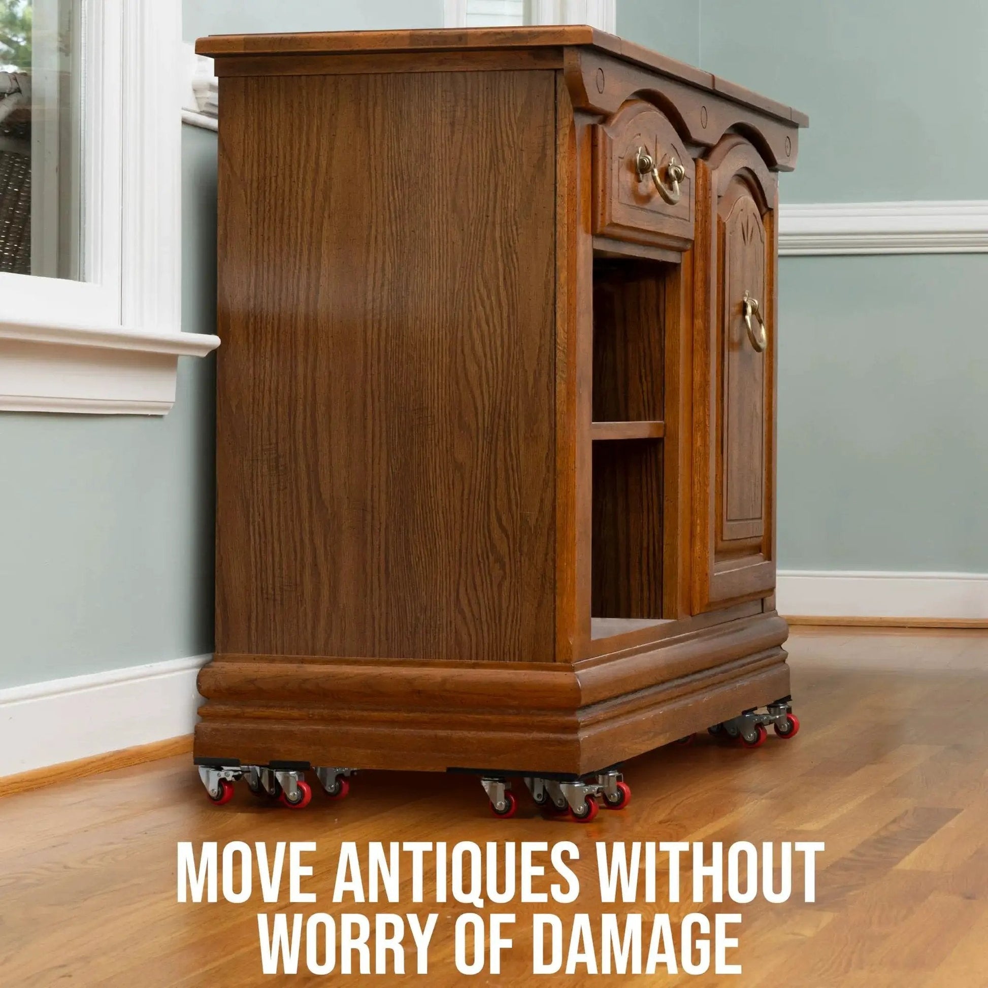 Heavy Duty Furniture Movers With Wheels Furniture Dolly Kit under wooden cabinet with red wheels on hardwood floor.